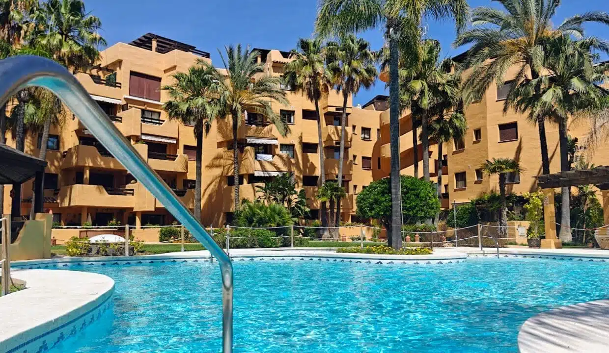 Residence pool surrounded by palm trees – apartment for rent, Terrazas de Costalita, Estepona (ref. AL037)
