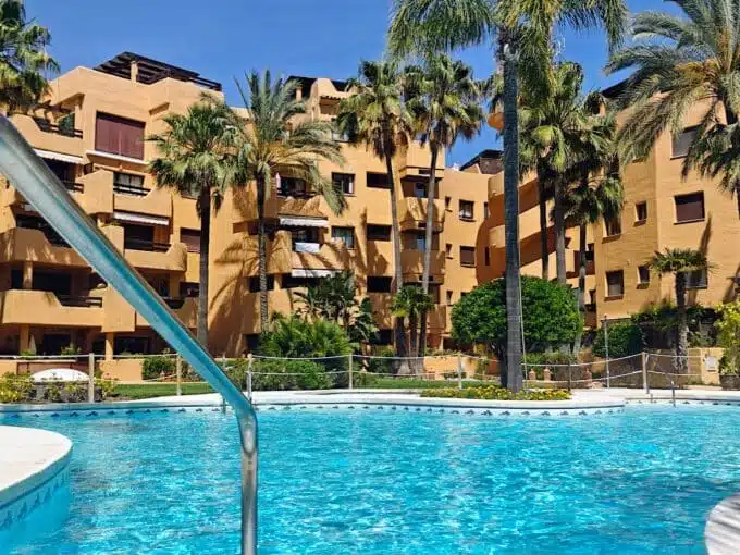 Residence pool surrounded by palm trees – apartment for rent, Terrazas de Costalita, Estepona (ref. AL037)