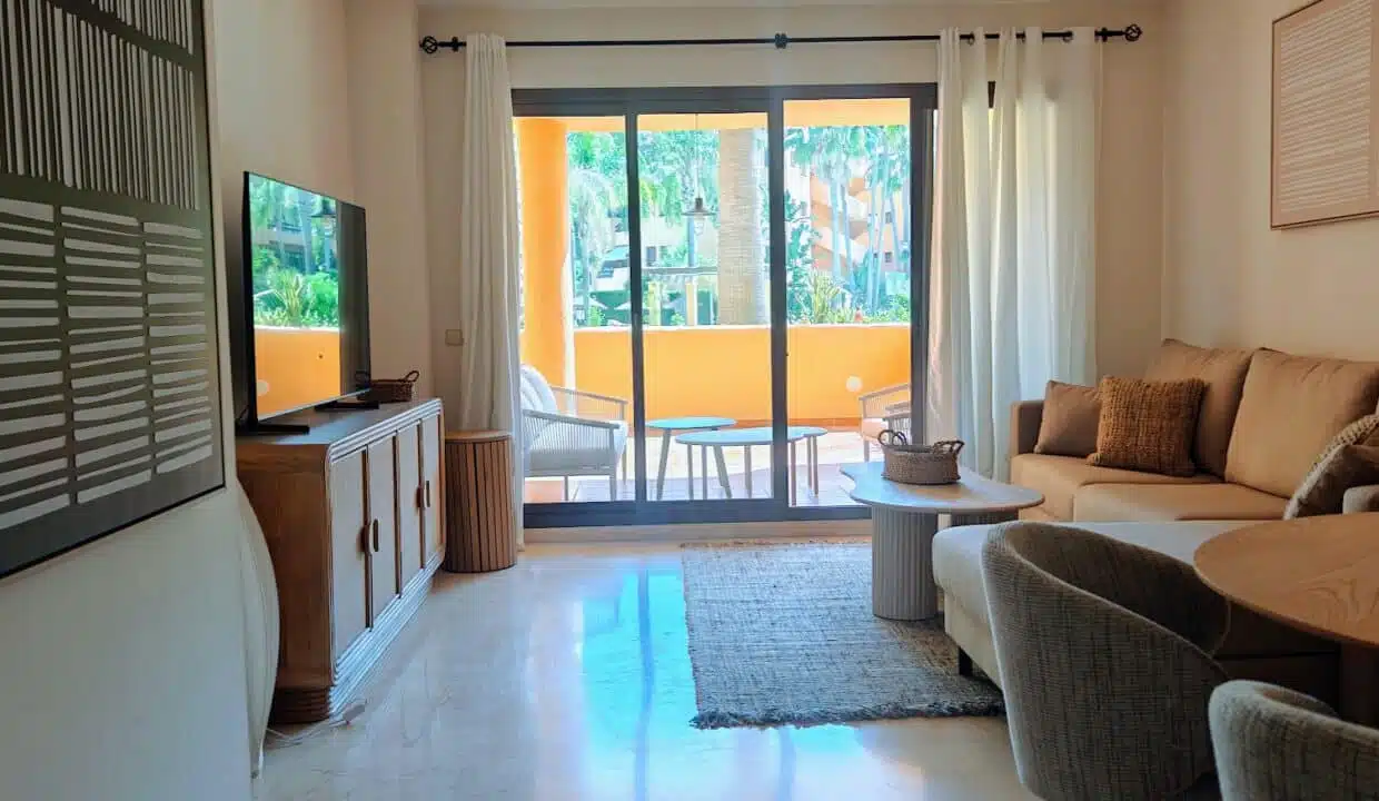 Living room with beige sofa, TV – apartment for rent, Terrazas de Costalita, Estepona (ref. AL037)